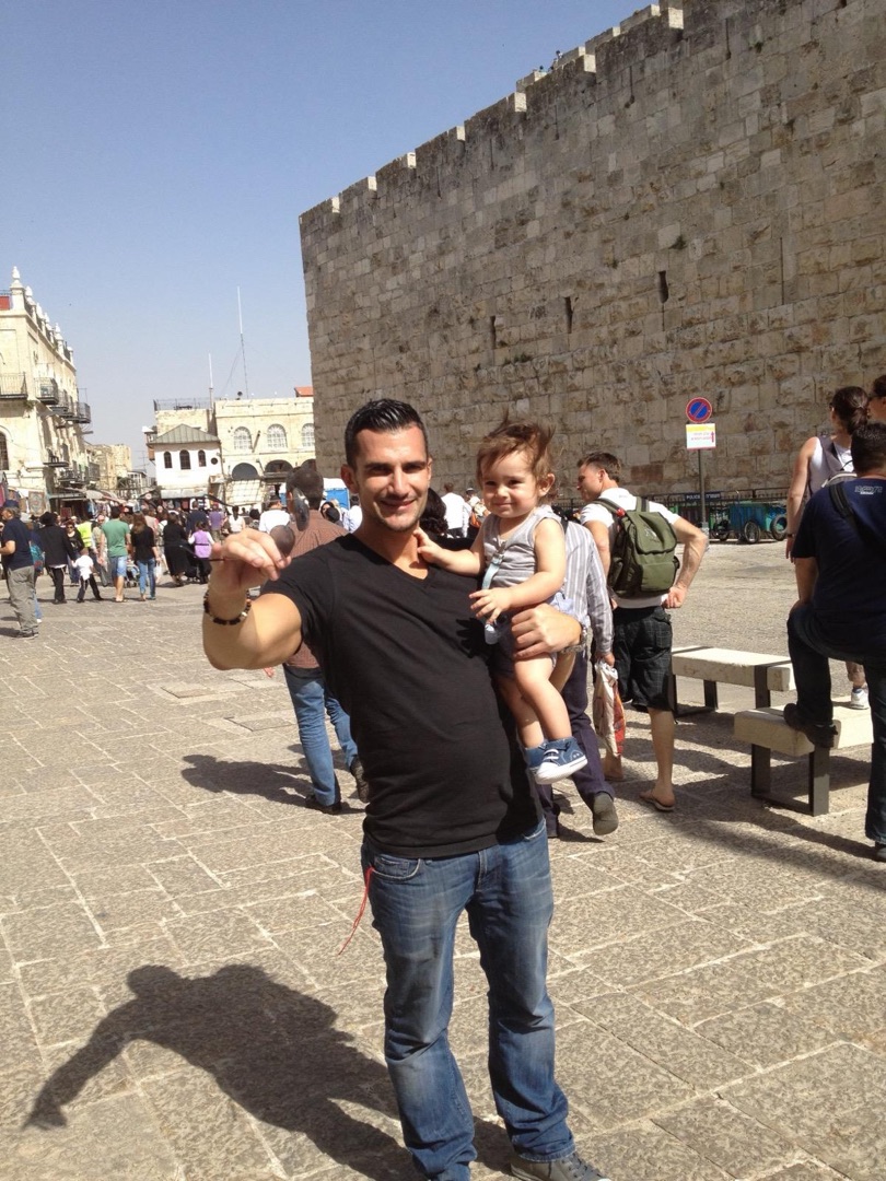 Dad holding Taye in Jerusalem