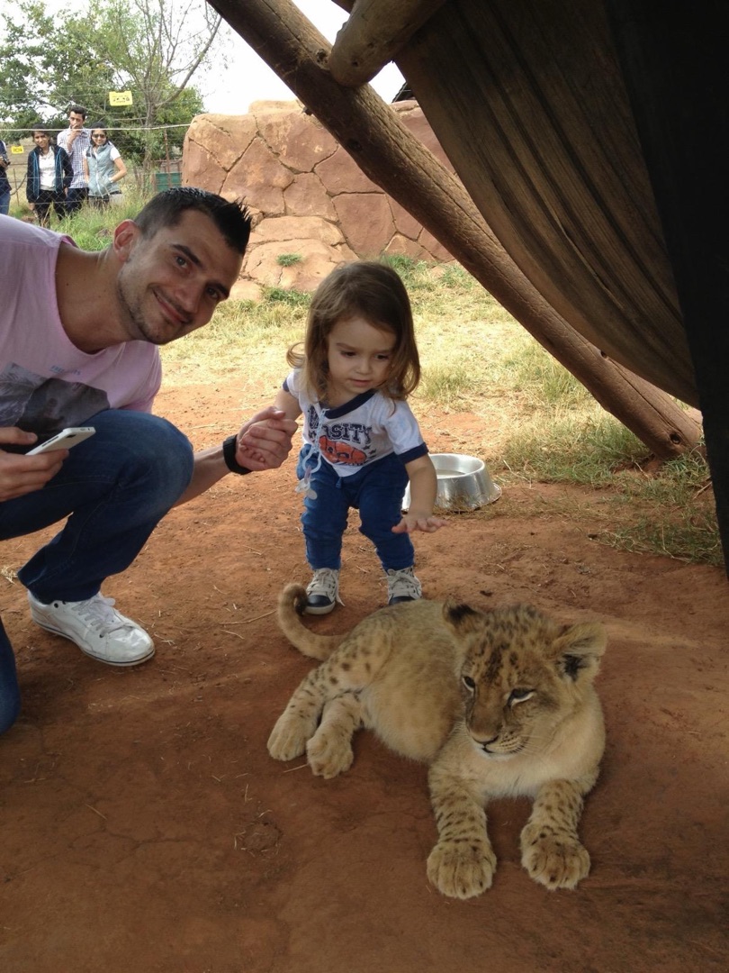 Dad and Taye with lion cub