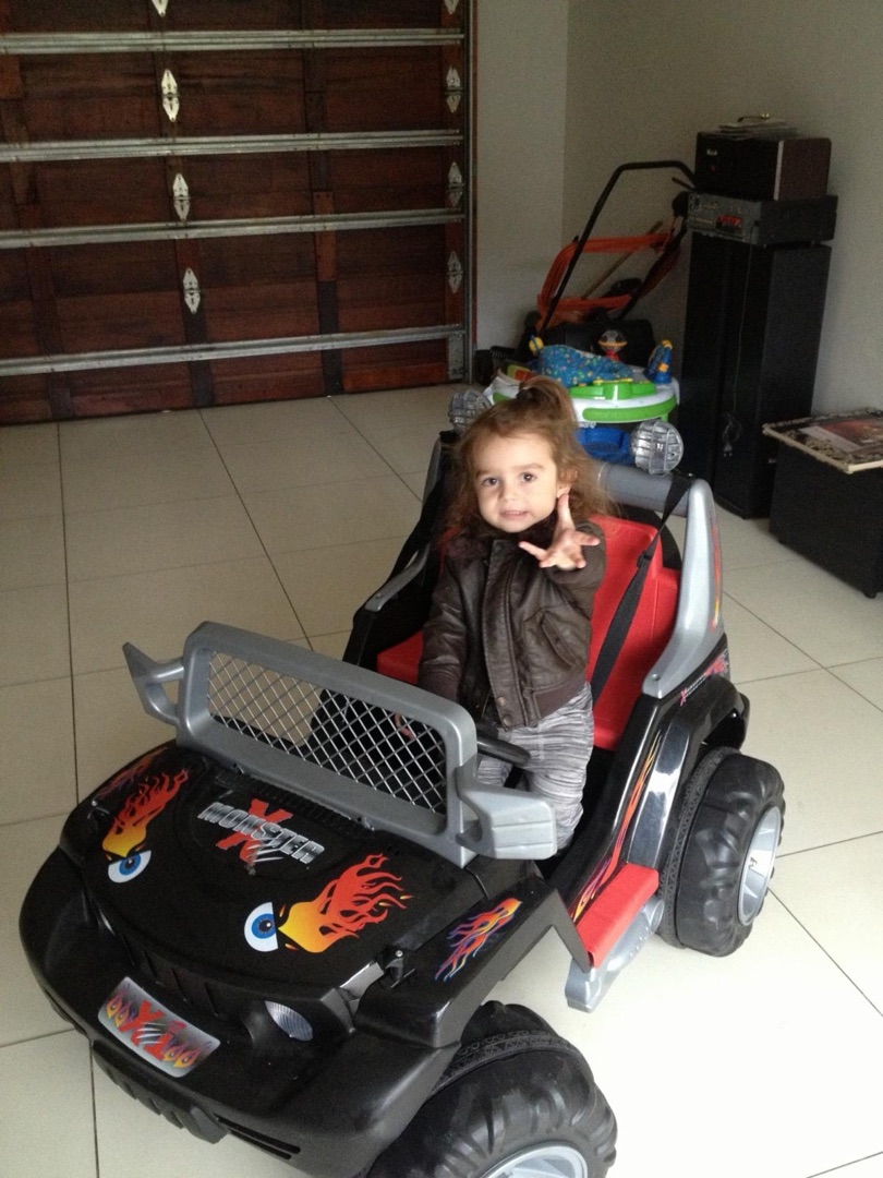 Taye in monster truck with leather jacket