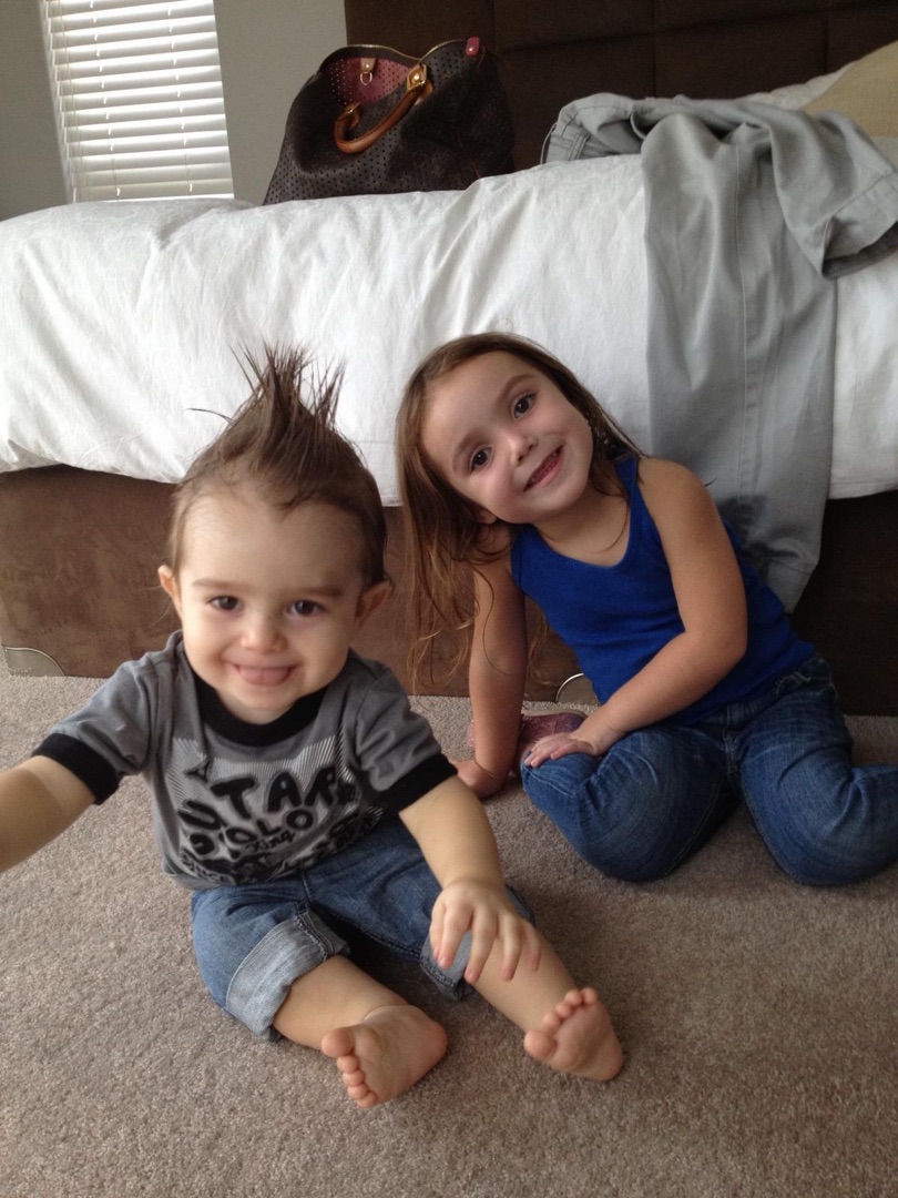 Toddler with mohawk and sibling